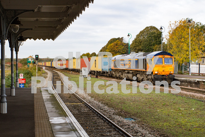 LPIS-D-DSL-CO-0004 
 GBRf Class 66, 66730 passes through Bury St. Edmunds station heading towards Ipswich with the late running 4L02 Hams Hall to Felixstowe container train on 1st November 2013. 
 Keywords: 66730, Bury St. Edmunds, Class66, Colour, Container, Digital, East Anglia, Eastern, Freight, GBRf, Rights Managed, Stock, Suffolk