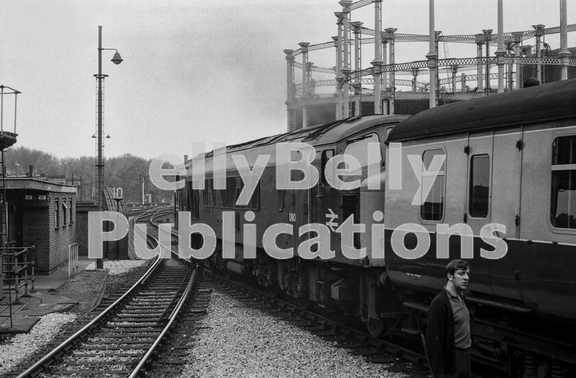 LPPC DSL BW 0241 
 Peak Class 45 number D90 begins to move a Midland main-line express out of London’s St Pancras station in the early 1970s under the watchful eye of a member of the maintenance staff.
At this time the Midland routes of the LMR tended to be overlooked in favour of the UK’s fastest developing lines out of neighbouring Euston undergoing transformation with 25Kv electrification. Nevertheless, the Peaks were putting up some very impressive performances with over-90mph running commonplace on the 99 mile stretch between London and Leicester. 
 Keywords: Digital, Rights Managed, Stock