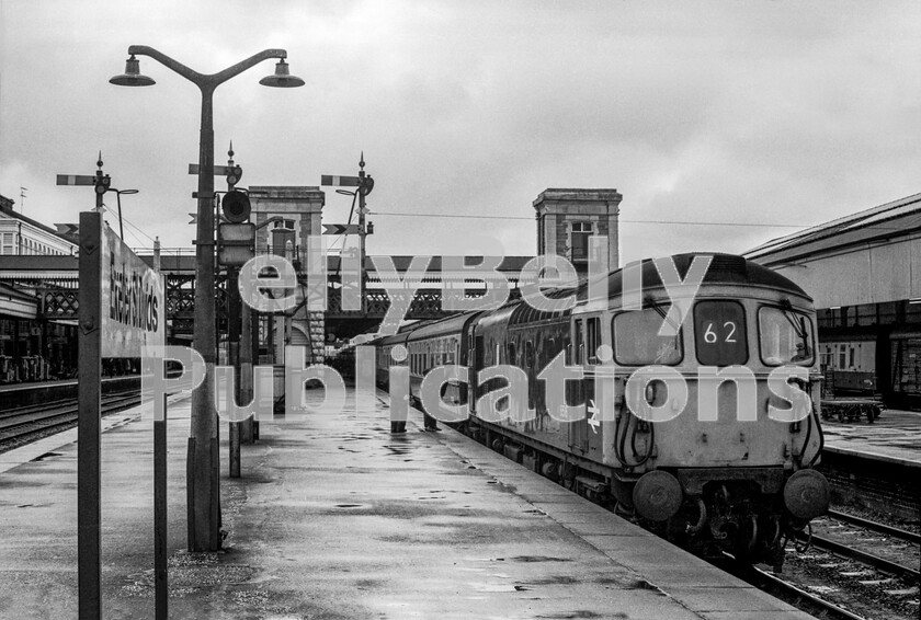 LPPC DSL BW 0636 
 A Crompton Class 33 Type 3 6516 (later 33104) of the Southern Region has arrived at Exeter St Davids, journeys end for this train from London Waterloo that has travelled via Salisbury and the erstwhile LSWR main-line. It seems it needs two platform staff to officiate over the uncoupling of the locomotive, after which it will run around its train of Mark 1 stock, ready for a return to London. When the SR line ran through to Plymouth via Okehampton it was always said that at St Davids there could be two trains, SR and WR, to that town in adjacent platforms but each facing in opposite directions. 
 Keywords: BR, Western, Passenger, Class 33, 6516, 33104, Exeter St Davids