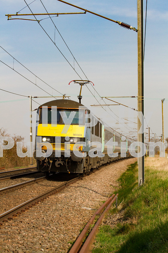 LPIS-D-DSL-CO-0008 
 90001 approaches Wassicks Lane level crossing at speed with the 1P31 11:00 Norwich to Liverpool Street service on 13th March 2014. 
 Keywords: 90001, Abellio, Class90, Colour, Digital, East Anglia, Eastern, Greater Anglia, Haughley Junction, Passenger, Rights Managed, Stock, Suffolk, Wassicks Lane Level Crossing