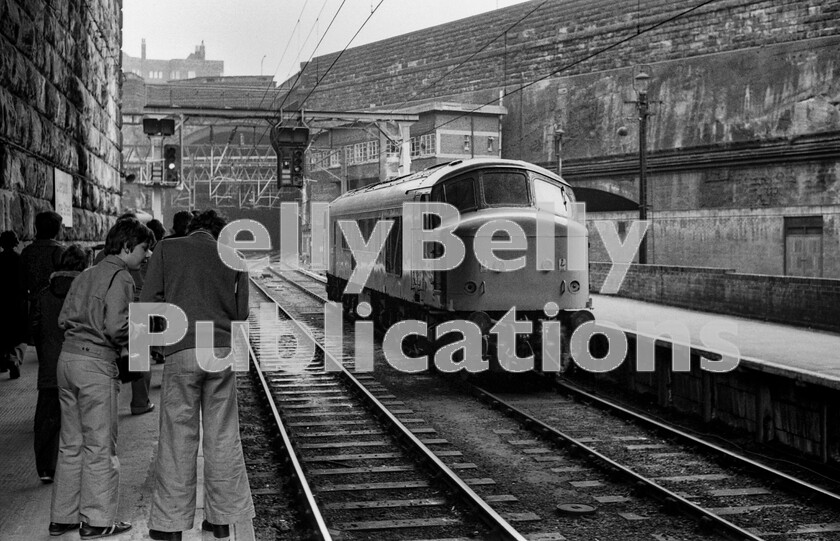 LPPC DSL BW 0524 
 The Bay City Rollers had much to answer for going by the sight of these two railfans comparing notes at the east end of Lime Street Liverpool station during a railtour loco exchange between two Class 40s.. An excellent day with fascinating itinerary had started from Euston to Crewe where the the first Class 40 number 40185 took over for freight lines and junctions throughout northern Lancashire and the North West. A fast run from Manchester led to a reversal and the second Class 40, number 40170, leading over CLC lines back to Crewe. The participants had been lucky enough to be headed by the doyen of the then rare Class 84, number 84001, between London and Crewe and return. 
 Keywords: Digital, Rights Managed, Stock