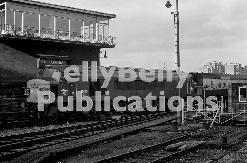 LPPC DSL BW 0504 
 The signalbox at St Pancras station was an anachronism that remained for some time when most London terminals signalling arrangements were generally being updated to eliminate the need for such structures. Here in the early 1970s, the 06.50 from Derby is arriving headed by the inevitable Sulzer Type 4 Peak Class 45 number 45140 after its sprint up from Kettering. The wagon lift to the undercroft, seen on Page 6, can more clearly be seen on the right. Behind and below the signalbox is the area that was once the vast Somers Town Goods Yard, now the British Library and from which, creating much excitement, in May 1969 a Vertical Take Off RAF Harrier jet aircraft landed and took off to break the New York to London journey time record. 
 Keywords: Digital, Rights Managed, Stock