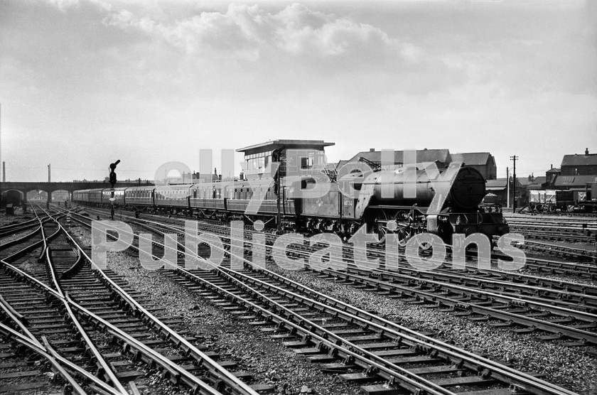 LPIS STM BW NEGS 0132 
 Gresley V2 60950 approaches Doncaster station from the south with what is believed to be the 07.05 Enfield - Scarborough on 8th Septemeber 1962. Trains were in chaos due to a derailment at Offord of A1 60123 'H. A. Ivatt'.

The V2 had been ousted from King's Cross Top Shed at the start of the Summer 1962 timetable, and was withdrawn from Doncaster shed a little over a year after this photograph was taken on 22nd September 1963, and broken up at the Works on the 5th November the same year. 
 Keywords: 1962, 1N10, 34F, 3652, 60950, 850, 950, BR, Black and White, Doncaster, Eastern, Grantham, Gresley, LNER, Passenger, Steam, V2, Yorkshire