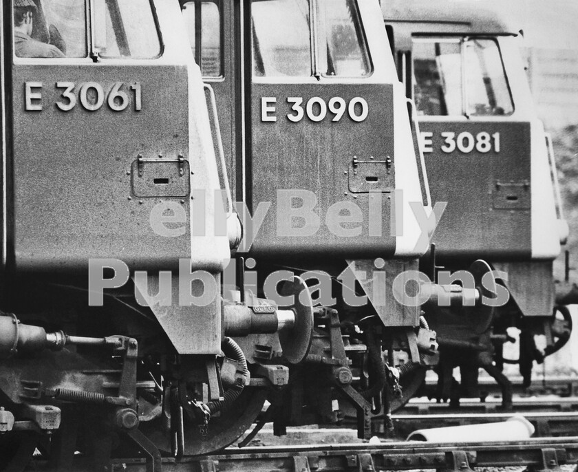 LPPC PHOT SCAN 0021 
 Its late one Sunday lunchtime and its warm and drowsy in the summer of 1972. Even at Crewe there is little traffic about at this time, before the afternoon and evening Sunday rush-hours start. Three Class AL5, as they were originally designated by BR in 1960, but later Class 85 3300hp locomotives are lined up in echelon as if awaiting a Le Mans 24 Hours race style of start. They are parked up on the west side of the north end of Crewe station, presumably awaiting the call to take over northbound expresses which will arrive from the south diesel-hauled, due to engineering works. By coincidence, the example in the foreground, E3061, has since become the only member of the class to survive in preservation by the AC Locomotive Society and now resides at Barrow Hill roundhouse museum. Note that a member of staff has found the locos cab a great place to laze on a summers afternoon.. 
 Keywords: Digital, Rights Managed, Stock