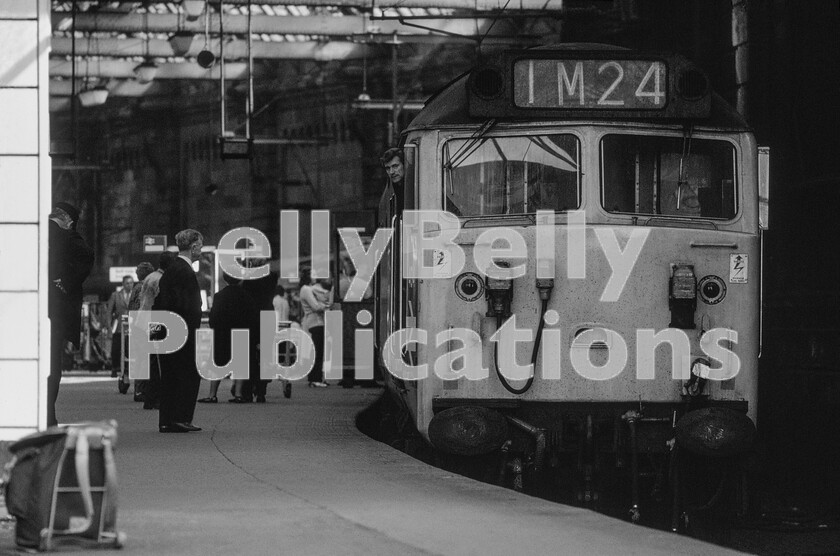 Galapagos 0009 
 Having arrived early in the morning from Inverness in July 1973, a brisk walk across Glasgow from Queen Street to Central got us to the latter station in time to catch the 1M24 10.10 Glasgow to Birmingham, a train that later had the title Midland Scot bestowed upon it. Here, the driver of English Electric Type 4 Class 50 number 404, later to become 50004, keeps his eye on us whilst a reasonable payload of passengers get themselves organised before departure. Interestingly BR only leased this class of engines from the constructor initially.