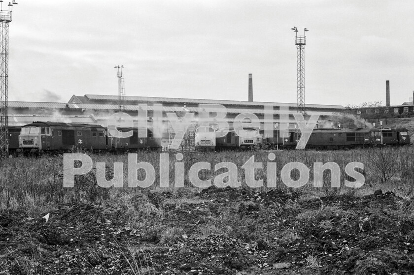 LPPC DSL BW 0994 
 The elimination of steam from the WR and BR meant engine shed demolition could take place and Old Oak Common  81A  was no exception. Here a group of working locos are parked around what was, by 1970, all that was left of the original roundhouse sheds. Hymeks D7071 and D7019, Class 42 Warship 821 Greyhound, Class 31 5535 (later 31117) and Class 47 1639 can be identified amongst the locos present. The Class 47 is still with us, having been renumbered 47055, the locomotive was fitted with ETH and became 47652, then 47807 operated by Virgin Trains. It was then chosen to be re-engined as part of the Virgin Thunderbird Class 57s and became 57304. The locomotive is currently operated by Direct Rail Services and is named Pride of Cheshire. The loco is the only thing that still exists from this photograph. 
 Keywords: 1970, BR, Black and White, D1639, D1747, D5535, D7049, D7071, D821, Factory, GWR, London, Old Oak Common, Shed, Western, turntable