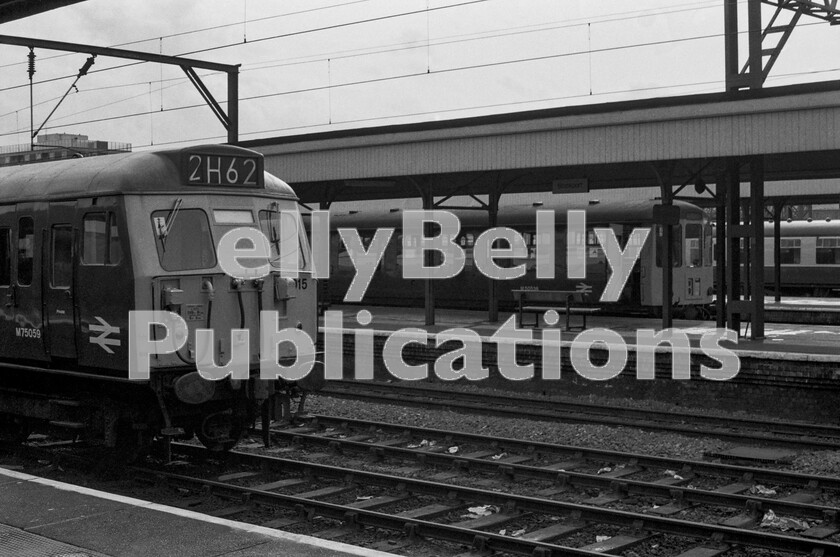 LPPC DSL BW 0489 
 Its Summer 1973 and a quiet early afternoon at Stockport station finds an AM6 Class 304 EMU number 015 lazing away on a middle road between duties. It is immaculate and has clearly recently been outshopped after overhaul. Meanwhile a Class 104 BRCW DMU idles for a few minutes whilst waiting for its driver to return to the cab. The DMU is more than likely on the way to Stalybridge, used by staff more than passengers and a long-standing Parliamentary service.