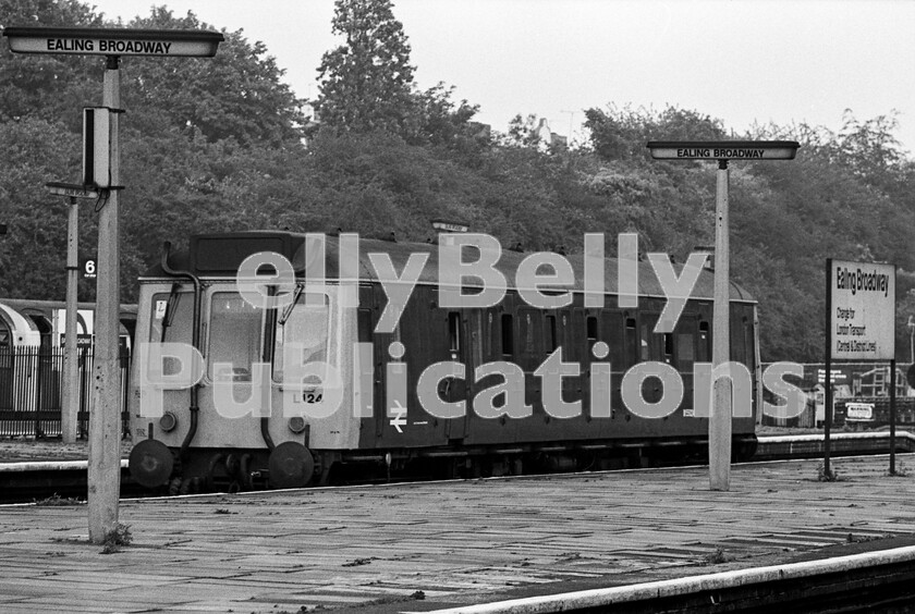 LPPC DSL BW 0410 
 Although the running-in board proclaims that Ealing Broadway is the changing point for London Transport services, it was also the originating point for the Western Regions local service to Greenford and here a single-unit Pressed Steel DMU awaits passengers and departure time. These double ended vehicles later became known to the railway enthusiast as bubble-cars. Many eras of modernisation are evident in the photograph, from the concrete late 1950s fluorescent-tubed station name signs, to the concept of single-unit diesel cars for branch-lines, to the late 1960s style of script on the running-in board. Not to mention the unpainted look of the Central Line LT train in the far platform. Having been converted to a sandite rail treatment car for the Chiltern Lines by BR, W55024 is now preserved on the Chinnor & Princes Risborough Railway and has been restored to its original condition. 
 Keywords: BR, Western, DMU, Bubble Car, W55024, Sandite, Preserved, Ealing Broadway