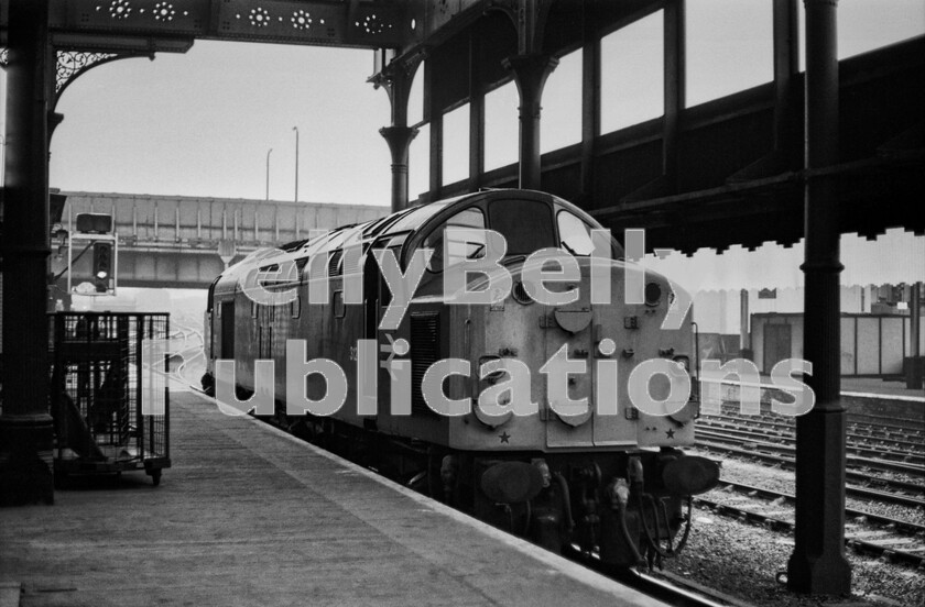 LPPC DSL BW 0671 
 Manchester Victorias unmistakeable Victorian ironwork frames English Electric Type 4 Class 40 number 312 (later 40112) as it stands waiting emitting the classs signature ringing sound before moving off uphill to the left with Newton Heath being its probable destination. This is the far eastern end of this platform, a place passengers would never have need to venture to and because of its length it always seemed quite lonely to be standing there. 
 Keywords: Digital, Rights Managed, Stock