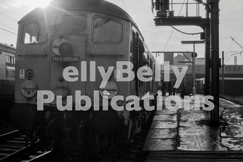 LPPC DSL BW 0391 
 You can hear and feel the slow clankety-clank tickover sound of a pair of BR Sulzer Type 2 Class 24, numbers 24083 and 24053 double-heading as they wait time at the northern end of Wolverhampton station on a damp autumnal morning soon after sunrise. Having been headed by Class 86 number 86012 from Euston on Saturday October 5th 1974 this is the annual Tallylyn Railway Preservation Society AGM special which was run every autumn from London to Towyn and return. The Type 2s have taken over from the Class 86 after a fast run from the capital and they will head to the Cambrian Coast via the little used Abbey Foregate curve behind the famous signalbox outside Shrewsbury station. 
 Keywords: Digital, Rights Managed, Stock