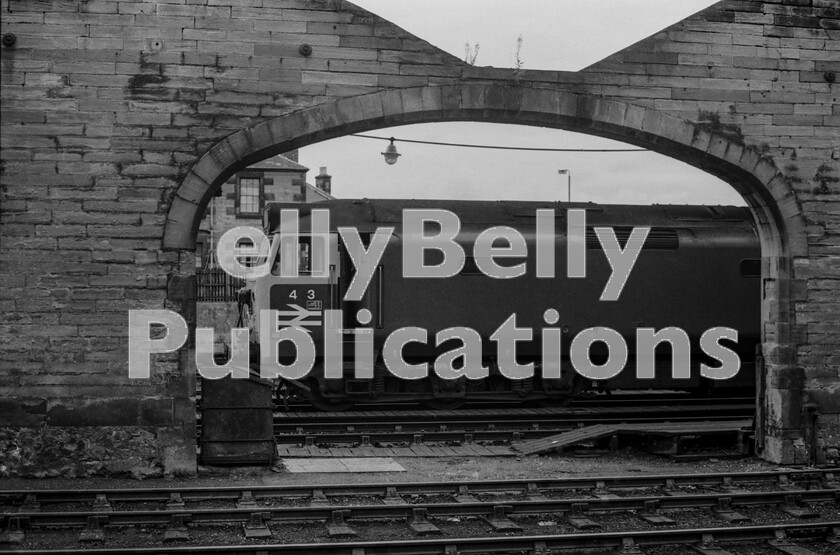 LPPC DSL BW 00726 
 In steam days Perth motive power depot was well worth a visit as it was usually full of LMR, ER and Standard locomotives. With the demise of steam the facility closed but during the interregnum before the wholesale replacement of all trains with multiple-unit working the city required stabling and layover facilities for diesel locomotives and that was found on the north side of the station adjacent to the Highland Line platforms. Whilst locos still hauled most long-distance and Inter City trains the Class 50s ruled north of Crewe before West Coast electrification and here number 443, which probably brought in the overnight Royal Highlander from Euston, is practising an early form of identity privacy before taking a southbound service back to the LMR. 
 Keywords: Digital, Rights Managed, Stock