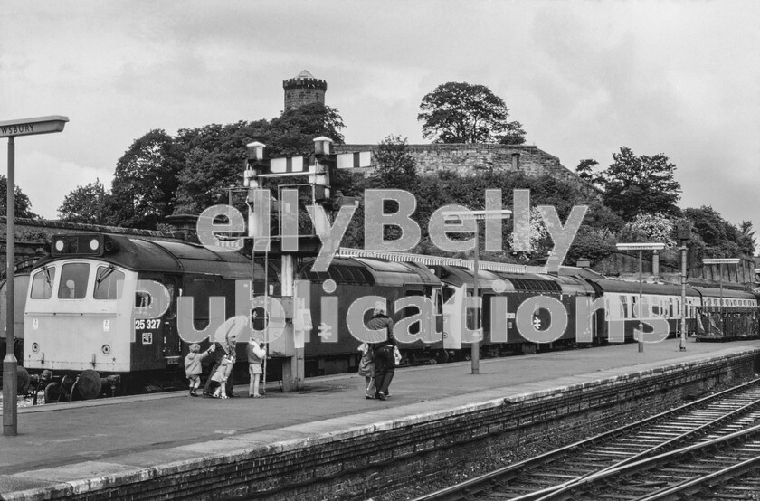 LPPC DSL CO 004900610073-Edit 
 High summer at Shrewsbury station and two BR Sulzer Type 2 Class 25s (25327 and 25283) come to a halt at the southbound platform starting signal with a dated summer timetabled train of Mark One stock, probably heading over the Cambrian main-line via Welshpool and Machynlleth to Aberystwyth from Manchester or Liverpool. Most of this traffic used to run at night, but this one didnt, creating interest in the family waiting on the platform, or perhaps they are off on holiday. Note how the two locomotives carry their running numbers in different locations on the sides of their bodywork. 
 Keywords: Digital, Rights Managed, Stock