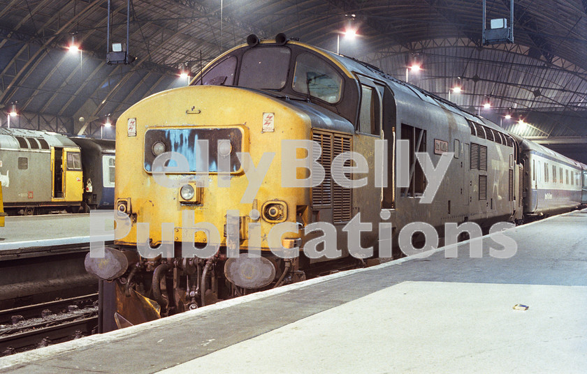 LPAP-DSL-CO-0140 
 Sitting on the blocks at Glasgow Queen St, is 37402 'Oor Wullie', having arrived on 1D15 the 1810 from Fort William. This was the last week of regular loco haulage on all West Highland line services, 20th January 1989. 
 Keywords: BR, Midland, LMS, Scotland, Glasgow, Diesel, BR, Passenger, Colour, Class37, 37402, D6989, LE, 1989