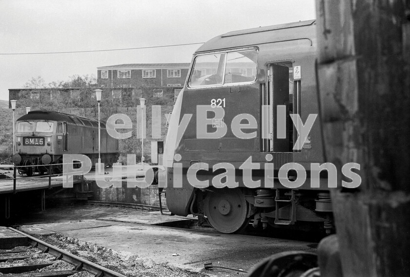 LPPC DSL BW 0992 
 Old Oak Common turntable in 1971 and the accident-damaged front corner of a down-at-heel Hymek fronts an exceptionally well-kept Warship Class 42 number 821 Greyhound, later to be adopted by preservationists, whilst a Brush Type 4 Class 47 1639 awaits its next turn of duty in the background. The first Brush Type 4 Class 47s to be allocated to OOC started to arrive during the winter of 1963/4 to take over the Birkenhead services from the Westerns and were thus forced to share the original Churchward quadruple turntable shed with the steam allocation. 
 Keywords: 1970, BR, Black and White, D1639, D821, Factory, GWR, London, Old Oak Common, Shed, Western, turntable