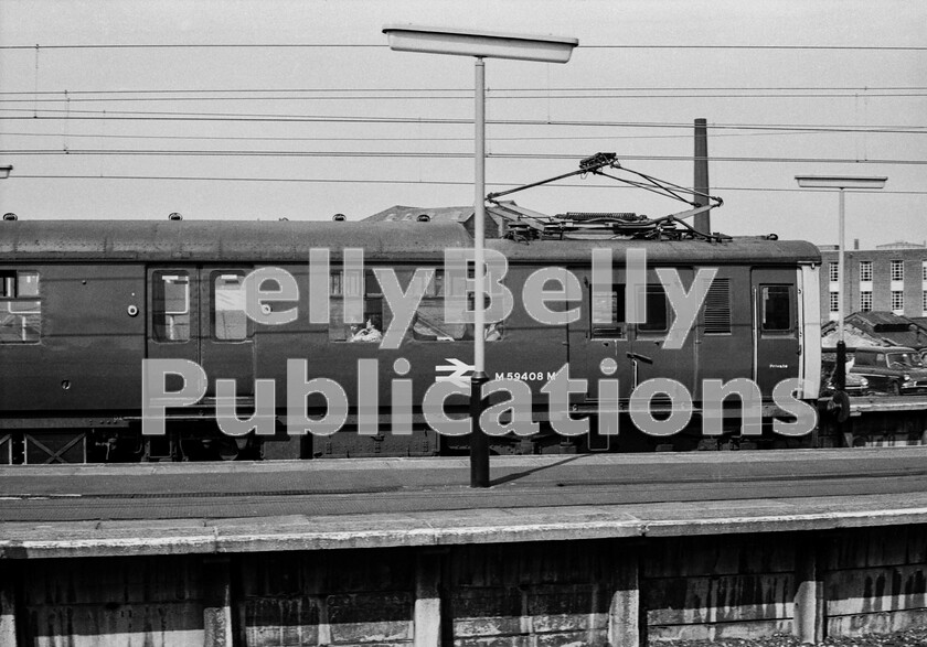 LPPC DSL BW 0381 
 Waiting at Manchester Piccadilly is an electric multiple unit bound for Hadfield and Glossop. To cope with and contribute to post-war industrial recovery, in 1954 a new bore was created under the Pennines alongside the then extant Woodhead Tunnel on the Great Central Railways route to London from Manchester. In addition, the line was electrified at 1500volts DC to pioneer modern traction for trains, in particular coal, across the backbone of industrial England. At the same time, EMUs of the same specification as those then recently introduced for London Liverpool Street to Shenfield services, were built for the suburban lines heading east from the then Manchester London Road. These evolved under TOPS to be Classes 306 and 506, the difference being that once the Shenfield line became equipped for 25Kv AC electrification, these Manchester 506 sets became the only overhead DC current collection passenger trains in the UK until their demise in 1981.