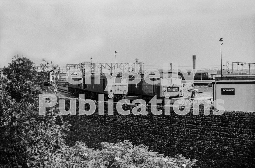 LPPC DSL BW 0885 
 Wolverhampton Banana Yard in 1976. Locomotives were stabled in what was the old freight handling facility for perishable goods. Here are two Sulzer Type 2 Class 25s and a Brush Type 4 Class 47. The two 25s may be parked up ready for a summer dated through train to Shrewsbury/Welshpool/Aberystwyth. Meanwhile, an AL6 Class 86 is either arriving or is standing in the neck at the north end of station while the staff Fords, an Escort and an Anglia, await their next trip.