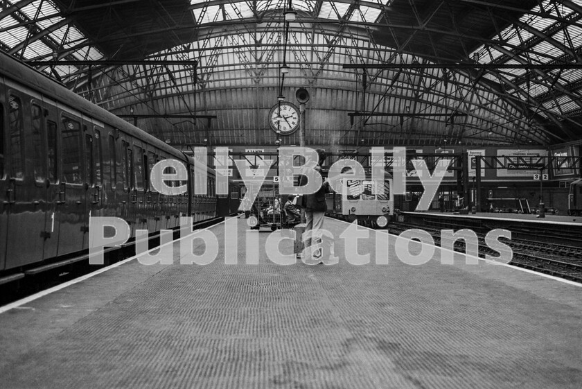 LPPC DSL BW 0385 
 As happened at most large urban terminal stations, there was always a quiet interlude after lunchtime for a couple of hours and Liverpool Lime Street was no different. This time its a summers afternoon in 1973 and an immaculate outshopped AM4 Class 304 25kv LMR Western Lines EMU stands silently before its next working south. At the adjacent platform face is a two-car DMU probably for stations to Manchester Oxford Road or Warrington. 
 Keywords: Digital, Rights Managed, Stock