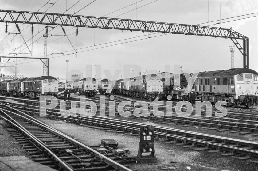 LPPC DSL CO 0182 original-Edit-Edit 
 A scene like this will never be repeated. This is Crewe Diesel Depot adjacent to the southern tip of Crewe station in the summer of 1973 and there are at least four classes of diesel locomotive on view. From left are at least two Sulzer Type 2 Class 24s, then two Brush Type 4 Class 47s, a Class 50, another Brush Type 4 Class 47. In a line are an English Electric Type 4 Class 40, another Sulzer Type 2, but a Class 25 and another Brush Type 4 Class 47, then on the right there is another Sulzer Type 2 Class 24 which has inexplicably been painted in duo-green, a livery never applied to any others of the Class. Today there is nothing to see with the completion of WCL electrification, closure of freight routes and the steady take-over of many passenger routes by multiple units. 
 Keywords: Digital, Rights Managed, Stock