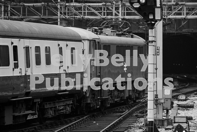 LPPC DSL BW 1246 
 Plenty of detail visible here as a 5000hp Class 87 Bo-Bo electric (87010) heads north-west out of Birmingham New Street heading for the final stop of the train from Euston at Sandwell and Dudley before terminating at Wolverhampton. Keeping to the right, it is about to plunge into the gloom of the tunnel to Smethwick. If it kept to the left, it would turn south past Five Ways and so to the Lickey Incline, Cheltenham and Bristol. 
 Keywords: Digital, ISO, John Stiles