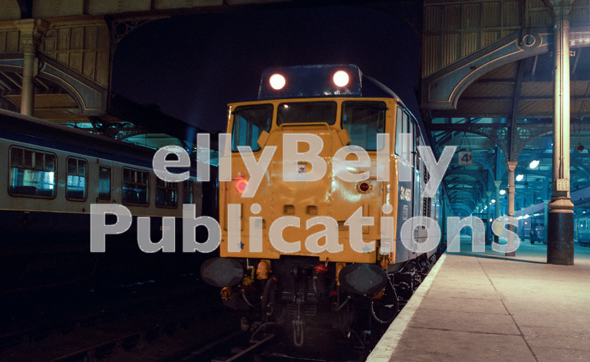 LPAP-DSL-CO-0110 
 With paint still glistening, newly converted 31463 sits on the blocks at Norwich after a working from Birmingham, 16th February 1985. 
 Keywords: BR, Eastern, LNER, Norfolk, Norwich, Diesel, BR, Passenger, Colour, Class31, 31463, 31297, D5830, TE, 1985