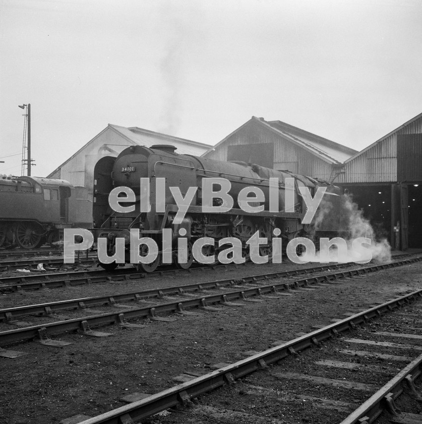 LPIS STM BW NEGS 0090 
 West Country pacific 34101 'Hartland' stand on Eastleigh shed on 12th June 1965. 
 Keywords: 34101, 'Hartland', 70D, WC, BR, Black and White, Southern, SR, Shed, Bullied, Eastleigh, Steam