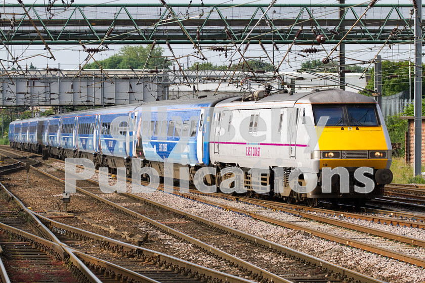 LPIS-D-DSL-CO-0041 
 East Coast Trains Class 91, 91119, approaches Doncaster station on 20th June 2014, with 1D02 from London King's Cross to Leeds. The coaching stock livery was advertsining the Sky programme 'All Aboard East Coast', a documentary series following staff on East Coast trains. 
 Keywords: 1D02, 91119, Class 91, Colour, Digital, Doncaster, East Coast Trains, Eastern, Passenger, Rights Managed, Sky, Stock, Yorkshire