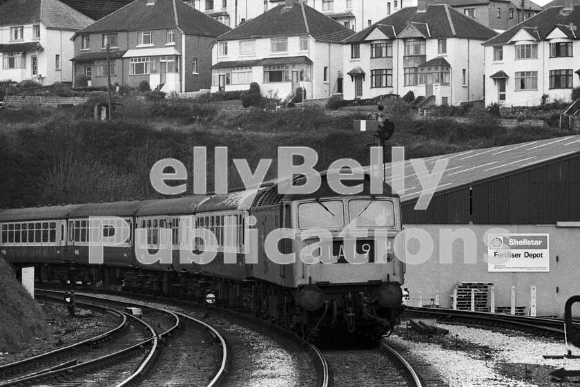 LPPC DSL BW 0901 
 An unidentified Class 47 approaches Truro station with the 11.00am 1A19 Penzance to Paddington service in the early 1970s. The industrial unit on the right occupies the space formerly taken by Truro Motive Power Depot. 
 Keywords: BR, Western, Class 47, Truro, 1A19, Passenger