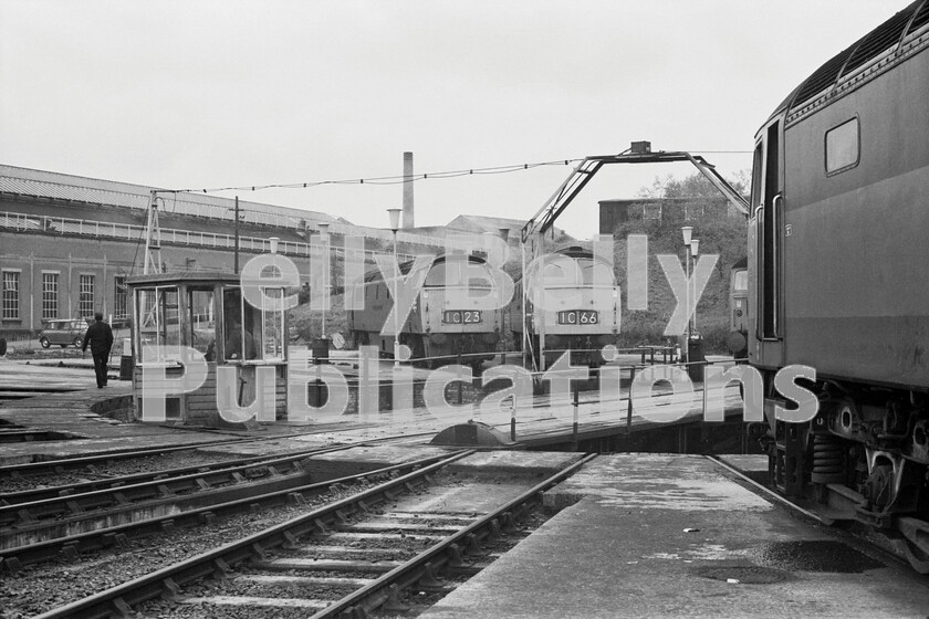 LPPC DSL BW 0991 
 The Western Class 52s were such handsome locomotives and these two (D1038 Western Sovereign on the left) are gathered around the last-remaining turntable at Old Oak Common motive power depot along with a couple of duo-green Brush Type 4 Class 47s (D1747, later 47154/47546, is on the right) in 1971. It was somewhat bizarre that a steam-age piece of equipment should still be needed in diesel days. This turntable was one of four at Old Oak originally laid out in a rectangle and all would have been inside a single vast building providing covered accommodation for many of OOCs top-link Kings, Castles, Halls and the nocturnal night-owls, the 47xx 2-8-0s, during the day plus all the locally allocated pannier tanks. Demolition of OOC began in March 1964 prior to all steam locos being moved away to Southall early in 1965. This is all that was left some 6-7 years later but the depot still remained open. 
 Keywords: 1970, BR, Black and White, D1747, Factory, GWR, London, Old Oak Common, Shed, Western, turntable