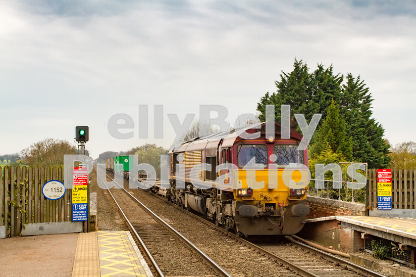 LPIS-D-DSL-CO-0018 
 DB Schenker Class 66, 66193 passes through Thurston station with 4L45 from Wakefield to Felixstowe on 31st March 2014. 
 Keywords: 66193, Class66, Colour, Container, DB Schenker, Digital, EWS, East Anglia, Eastern, Freight, Rights Managed, Safety, Stock, Suffolk, Thurston